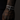 Silver bracelet on a tattooed wrist against a dark background