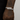 Bracelet with diamond accents on a wrist with tattoos